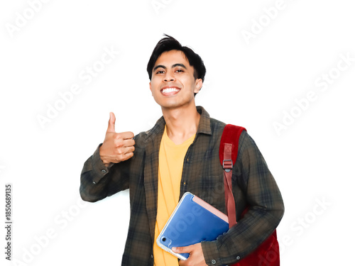 Smiling confident young male student wearing casual clothes and backpack, holding digital tablet and giving thumbs up gesture, isolated on white background. 