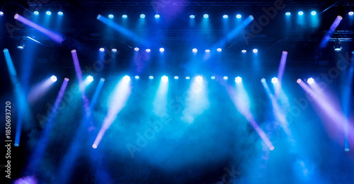 Stage light with colored spotlights and smoke.