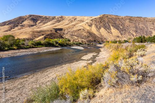 Deserted hills range and water of Yakima River in autumn season. Washington, USA
