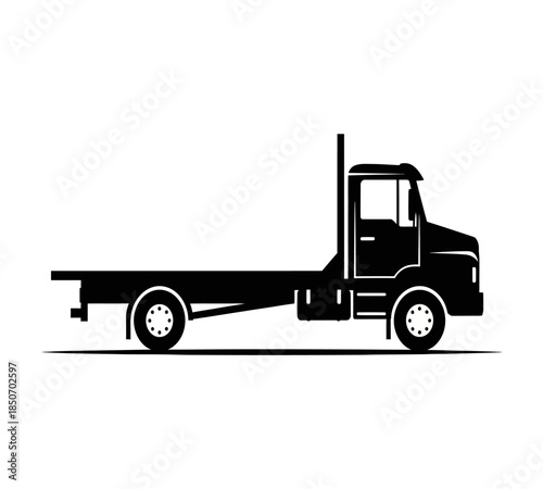 A sleek black silhouette of a semi truck with a flatbed trailer is displayed against a plain white background