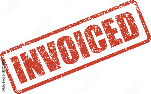 A distressed red rubber stamp impression clearly displays the word INVOICED on a clean white surface