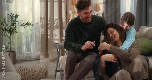 Happy family enjoys a warm group hug with their dog in a modern living room. Love, connection, comfort, and joyful family time at home.