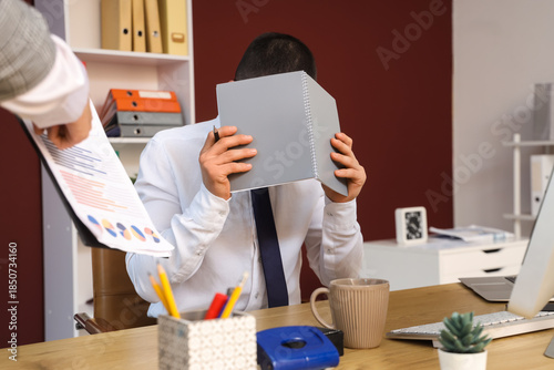 Stressed male worker with n...