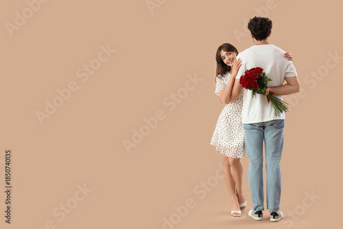 Young couple with red roses...