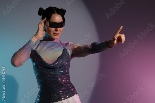 Stylish young woman in VR g...