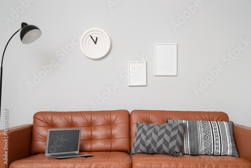 Brown leather sofa with mod...