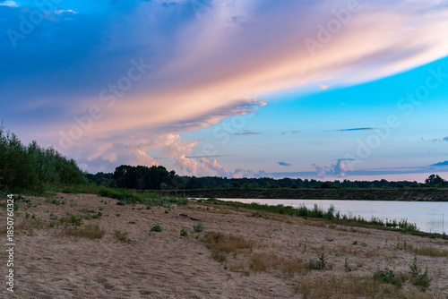 Sunset on the cloudy river.