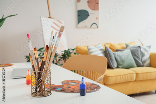 Art supplies on table in student's room, closeup
