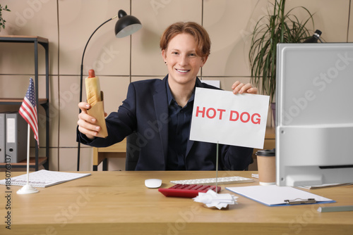 Young happy businessman wit...