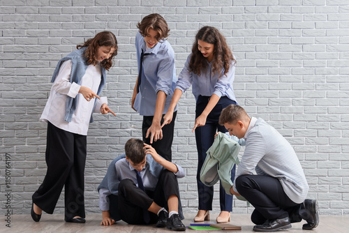 Schoolmates bullying teenag...