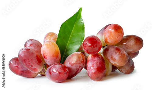 A bunch of sweet ripe red crimson grape with green leaf isolated on white background with clipping path