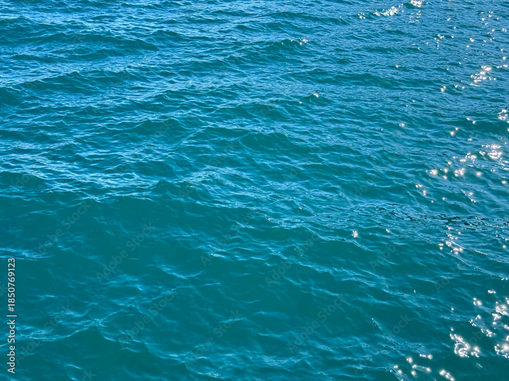 Obraz premium Ocean blue waters surface background.