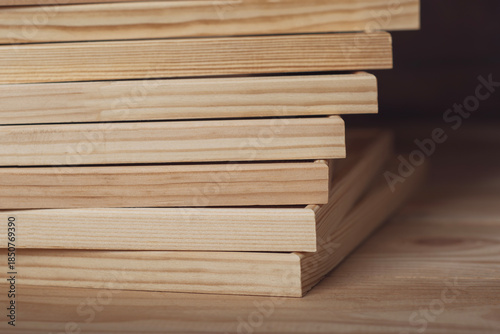 Many wooden stretcher frames lying on wooden table