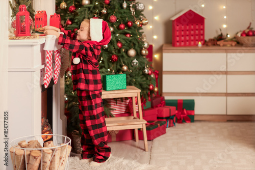 Cute little girl in Santa h...