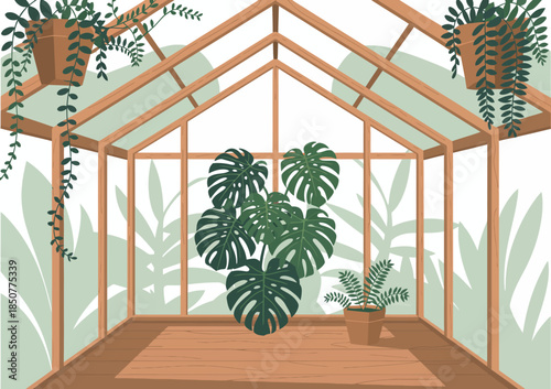 Inside this spacious greenhouse, various lush plants thrive under natural light, creating a serene environment perfect for nurturing and cultivating botanical life.