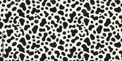 Black and white dalmatian dog or animal skin irregular spots pattern.