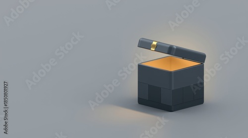 Open dark blue gift box with golden glow inside on gray background. Surprise concept.