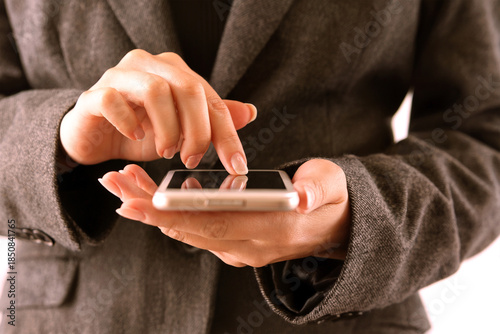 Business Professional Using Smartphone with Touchscreen Interface for Mobile Communication and Technology Concept