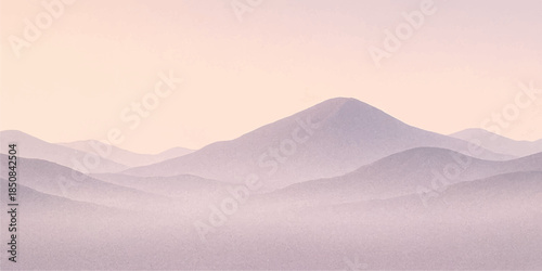 A breathtaking mountain landscape at sunrise features peaks shrouded in misty fog as golden sunlight breaks through the clouds over a serene valley range
