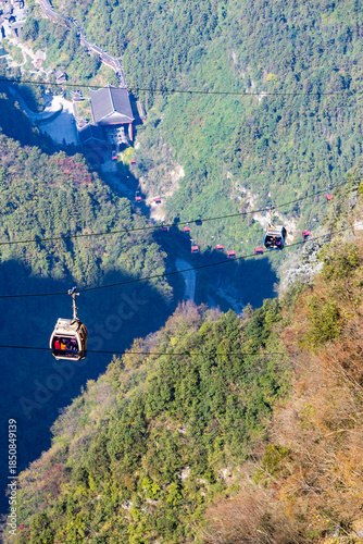 Zhangjiajie, hunan, China. 11-09-2024. Cable car to Tianmen Mountain above the buildings of Zhangjiajie City in Hunan, China.