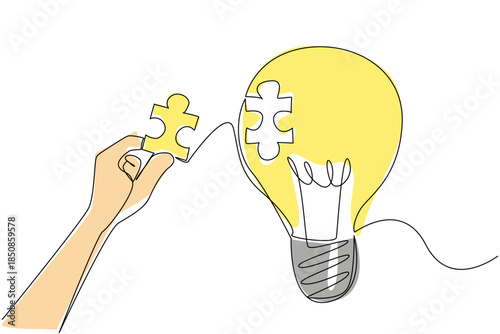 Single one line drawing hand holds puzzle piece and wants to stick it to the surface of hollow bulb. Patching the void of thought. National Creativity Day. Continuous line design graphic illustration