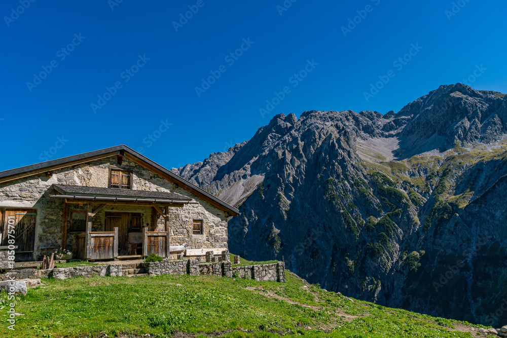 Fototapeta premium Serene Mountain Chalet Amidst Austrias Stunning Gadental Valley Alpine Scenery