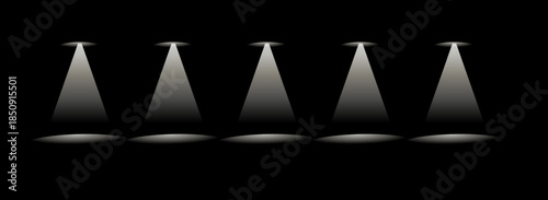 Spotlight beams shining down on empty stage - black background