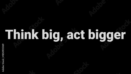 Motivational phrase think big act bigger displayed in bold white text against a solid black background