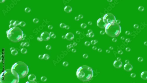 Flying water bubbles green screen motion graphics, 4k, loop. flying soap bubbles on green screen background , vertical orientation. Soap bubbles rise towards a green screen
