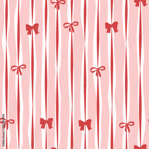 Seamless pattern with hand drawn red bows and ribbons with pink stripes on the background. Perfect for fabric, wallpapers and gift designs