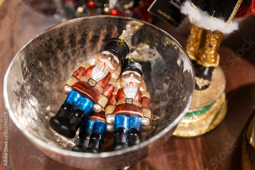 London, UK, December 13, 2025, Fortnum and Mason shop. The glass nutcracker ornaments in a silver metal bowl