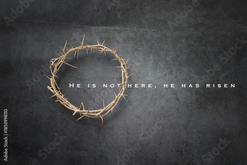Crown of Thorns on a Grey Textured Background . Text He is not Here He is Risen
