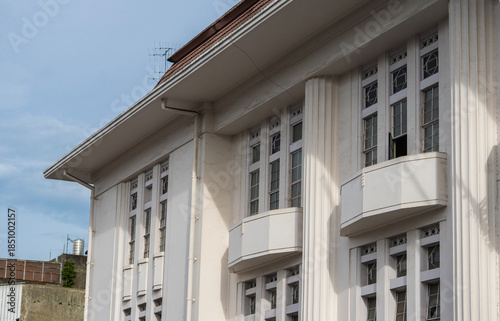 Close-up of the Pos Indonesia building facade. A landmark of Dutch colonial architecture in Bandung, West Java, featuring classic Art Deco style and vertical lines.