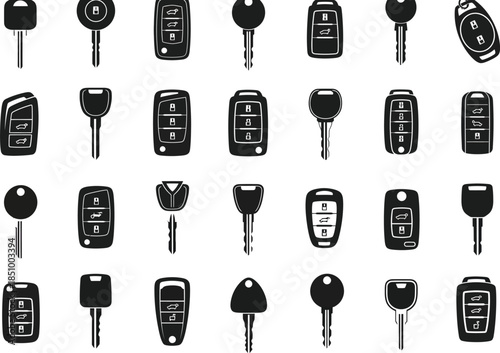 Collection of various car keys and remote controls on white background