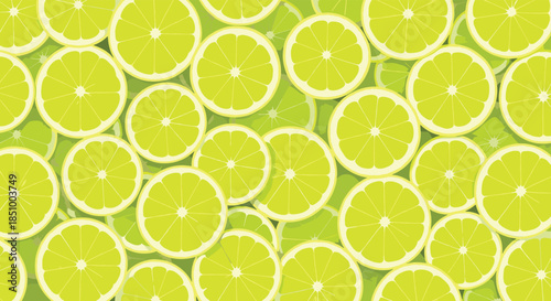 A bright and zesty background completely filled with vibrant, overlapping slices of fresh green and yellow lime citrus fruit.