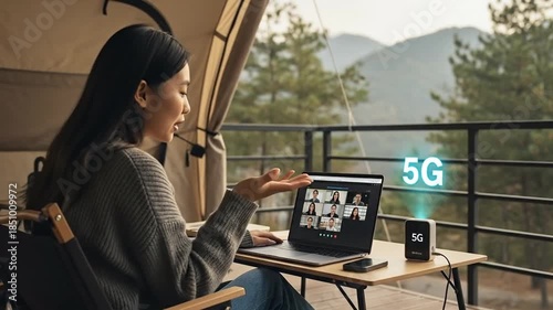 Young woman enjoying high speed 5G internet connection while working remotely in nature.
