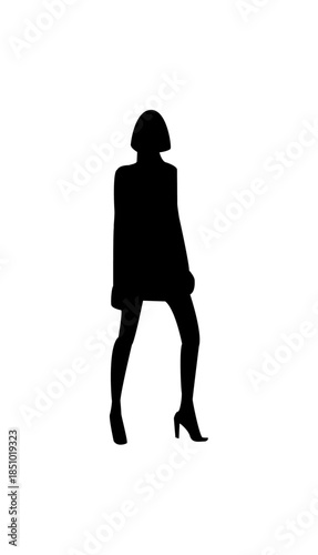 Casual woman in tunic and fitted pants standing relaxed, isolated white background