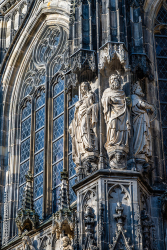 Aachen Cathedral Gothic window tracery and apostle statues close up