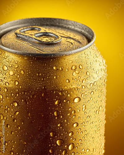 Golden Beer Can with Condensation on Matching Background in Close Up Composition