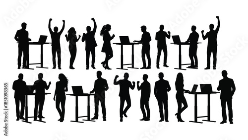 A group of people at desks and tables shown in a dark contrasting silhouette