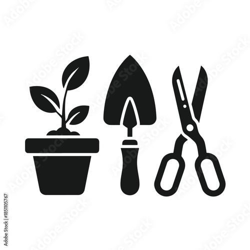 Black and white of potted plant, trowel, and scissors