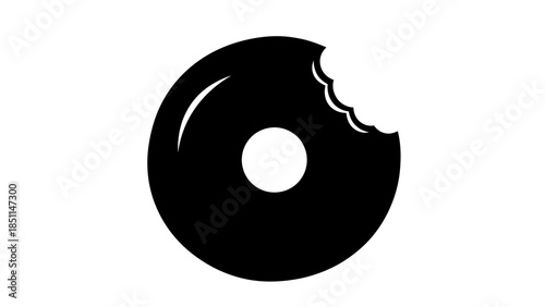 Black donut with a bite taken out of it isolated on white.