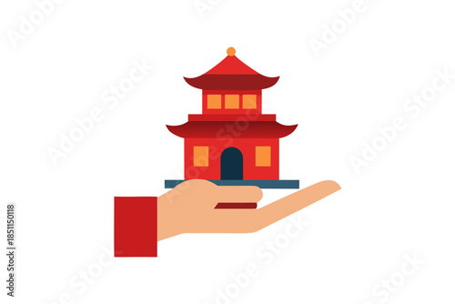 Hand Holding Chinese House Model for Home Loan and Real Estate Investment