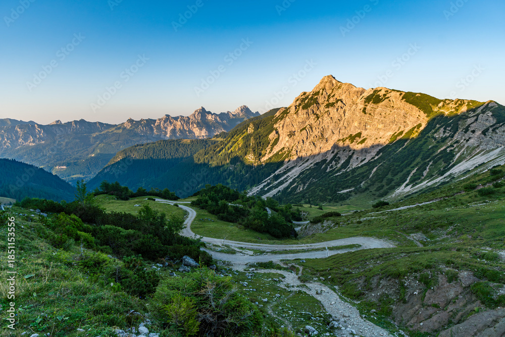 Naklejka premium Serene Mountain Hike Through Tannheimer Valleys Stunning Three-Lake Scenic Paradise