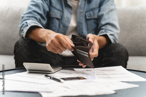 Cuadro en lienzo Bankruptcy problem financial concept, Young man opening empty wallet stress to find money to pay debt mortgage  period