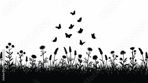 Butterflies flying above a field of flowers and grass in a serene landscape from a low viewpoint