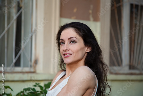 Portrait of a young woman smiling and enjoying spring day outdoor. Closeup emotion cute girl Free Download Portrait of a young woman smiling and enjoying spring day outdoor. Closeup emotion cute girl - GFXLoad
