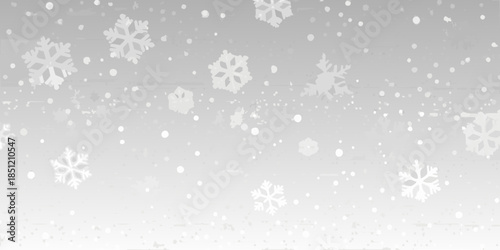 Gentle snowfall with delicate white snowflakes against a soft gray background