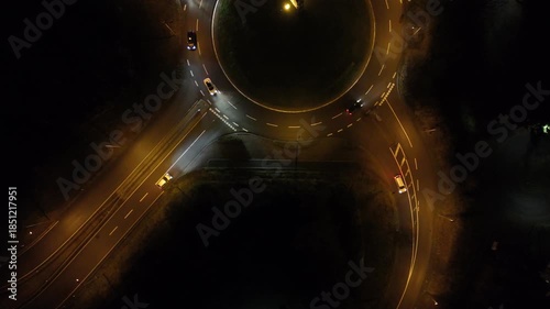 Aerial Night View of Roundabout with Moving Traffic