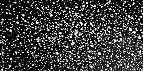 Abstract black and white speckled texture with a random distribution of dots